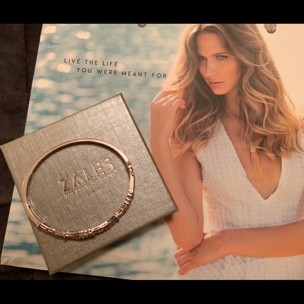 1/8 CT. T.W. Diamond Loose Braid Bangle.
